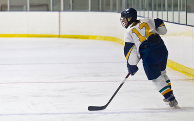 adult playing hockey